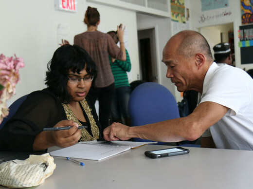 A teacher and student working together